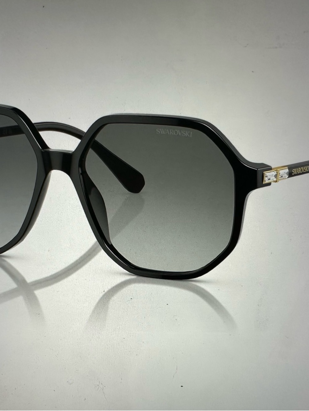 Swarovski Women’s Black Geometric Sunglasses with Gold Accents